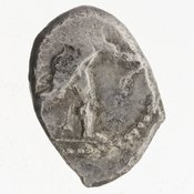 Obverse 'SilCoinCy A7046, Bequest of E.T. Newell, acc.no.: 1944.100.57963. Silver coin of king Ozibaal of Kition 450 - 425 BC. Weight: 3.5470000000000002g, Axis: 6h, Diameter: 14mm. Obverse type: Heracles advancing r. holding club and bow. Obverse symbol: -. Obverse legend: - in -. Reverse type: lion devouring stag r. within incuse square. Reverse symbol: -. Reverse legend: [l']zb'l in Phoenician.