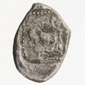 Reverse 'SilCoinCy A7046, Bequest of E.T. Newell, acc.no.: 1944.100.57963. Silver coin of king Ozibaal of Kition 450 - 425 BC. Weight: 3.5470000000000002g, Axis: 6h, Diameter: 14mm. Obverse type: Heracles advancing r. holding club and bow. Obverse symbol: -. Obverse legend: - in -. Reverse type: lion devouring stag r. within incuse square. Reverse symbol: -. Reverse legend: [l']zb'l in Phoenician.