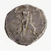 Obverse 'SilCoinCy A7061, E.T. Newell coll., acc.no.: 1944.100.57983. Silver coin of king Baalorm of Kition 400 - 392 BC. Weight: 11.256g, Axis: 7h, Diameter: 21mm. Obverse type: Heracles advancing r. holding club and bow. Obverse symbol: Ankh. Obverse legend: - in -. Reverse type: lion devouring stag r. within incuse square. Reverse symbol: three test cuts on the reverse. Reverse legend: lb'lr[m] in Phoenician.