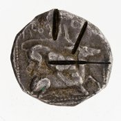Reverse 'SilCoinCy A7061, E.T. Newell coll., acc.no.: 1944.100.57983. Silver coin of king Baalorm of Kition 400 - 392 BC. Weight: 11.256g, Axis: 7h, Diameter: 21mm. Obverse type: Heracles advancing r. holding club and bow. Obverse symbol: Ankh. Obverse legend: - in -. Reverse type: lion devouring stag r. within incuse square. Reverse symbol: three test cuts on the reverse. Reverse legend: lb'lr[m] in Phoenician.