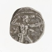 Obverse 'SilCoinCy A7063, Gift of Christian G. Gunther. March 1949, acc.no.: 1951.116.105. Silver coin of king Uncertain king of Kition of Kition 525 - 480 BC. Weight: 10.8g, Axis: 5h, Diameter: 17mm. Obverse type: Heracles advancing r. holding club and bow. Obverse symbol: -. Obverse legend: - in -. Reverse type: lion devouring stag r.. Reverse symbol: -. Reverse legend: not visible in Phoenician.