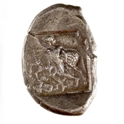 Οπισθότυπος 'SilCoinCy A7675, acc.no.: 1951.116.125. Silver coin of king Sasmas of Marion 450 BC - . Weight: 11.055999999999999g, Axis: 5h, Diameter: -. Obverse type: lion advancing r. licking forepaw, in ex. scroll pattern. Obverse symbol: -. Obverse legend: sa-sa-ma- in Cypriot syllabic. Reverse type: Phrixus striding l. beside ram, within incuse square. Reverse symbol: Double axis. Reverse legend: - in -.