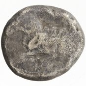 Obverse 'SilCoinCy A7684, Gunther, C. Godfrey, acc.no.: 1951.116.158. Silver coin of king Evelthon of Salamis 525 - 500 BC. Weight: 10.765000000000001g, Axis: 3h, Diameter: -. Obverse type: ram lying l.. Obverse symbol: -. Obverse legend: - in Cypriot syllabic. Reverse type: ankh within incuse square. Reverse symbol: -. Reverse legend: ku in Cypriot syllabic.