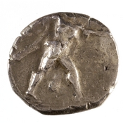 Obverse 'SilCoinCy A7666, acc.no.: 1951.116.77. Silver coin of king Ozibaal of Kition 450 - 425 BC. Weight: 10.916g, Axis: 9h, Diameter: -. Obverse type: Heracles advancing r. holding club and bow. Obverse symbol: -. Obverse legend: - in -. Reverse type: lion devouring stag r. within incuse square. Reverse symbol: -. Reverse legend: l'zb'[l] in Phoenician.