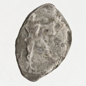 Obverse 'SilCoinCy A7047, Gift of G. Gunther, March 1949, acc.no.: 1951.116.79. Silver coin of king Ozibaal of Kition 450 - 425 BC. Weight: 3.4169999999999998g, Axis: 3h, Diameter: 13mm. Obverse type: Heracles advancing r. holding club and bow. Obverse symbol: -. Obverse legend: - in -. Reverse type: lion devouring stag r. within incuse square. Reverse symbol: -. Reverse legend: l'zb'l in Phoenician.