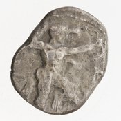 Obverse 'SilCoinCy A7058, Gift of Christian G. Gunther. March 1949, acc.no.: 1951.116.81. Silver coin of king Baalmilk II of Kition 425 - 400 BC. Weight: 10.66g, Axis: 7h, Diameter: 19mm. Obverse type: Heracles advancing r. holding club and bow. Obverse symbol: -. Obverse legend: - in -. Reverse type: lion devouring stag r. within incuse square. Reverse symbol: -. Reverse legend: [lb]'lml[k] in phoenician.