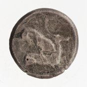 Reverse 'SilCoinCy A7060, Gift of Christian G. Gunther. March 1949, acc.no.: 1951.116.82. Silver coin of king Baalmilk II of Kition 425 - 400 BC. Weight: 10g, Axis: 2h, Diameter: 20mm. Obverse type: Heracles advancing r. holding club and bow. Obverse symbol: -. Obverse legend: - in -. Reverse type: lion devouring stag r.. Reverse symbol: -. Reverse legend: [b'lmlk] in Phoenician.