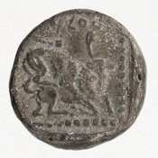 Reverse 'SilCoinCy A7051, Gift of Christian G. Gunther. March 1949, acc.no.: 1951.116.87. Silver coin of king Baalmilk II of Kition 425 - 400 BC. Weight: 3.512g, Axis: 10h, Diameter: 15mm. Obverse type: Heracles advancing r. holding club and bow. Obverse symbol: -. Obverse legend: - in -. Reverse type: lion devouring stag r. within incuse square. Reverse symbol: -. Reverse legend: [l]b'lml[k] in Phoenician.