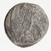 Obverse 'SilCoinCy A7054, acc.no.: 1951.116.88. Silver coin of king Baalmilk II of Kition 425 - 400 BC. Weight: 3.35g, Axis: 6h, Diameter: 15mm. Obverse type: Heracles advancing r. holding club and bow. Obverse symbol: -. Obverse legend: - in -. Reverse type: lion devouring stag r. within incuse square. Reverse symbol: complete Rev. legend. Reverse legend: lb'lmlk in Phoenician.
