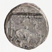 Reverse 'SilCoinCy A7054, acc.no.: 1951.116.88. Silver coin of king Baalmilk II of Kition 425 - 400 BC. Weight: 3.35g, Axis: 6h, Diameter: 15mm. Obverse type: Heracles advancing r. holding club and bow. Obverse symbol: -. Obverse legend: - in -. Reverse type: lion devouring stag r. within incuse square. Reverse symbol: complete Rev. legend. Reverse legend: lb'lmlk in Phoenician.