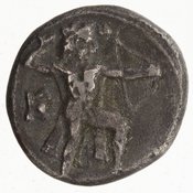 Εμπροσθότυπος 'SilCoinCy A7066, acc.no.: 1968.184.11. Silver coin of king Demonikos I of Lapethos 525 - 480 BC. Weight: 3.2749999999999999g, Axis: 5h, Diameter: 15mm. Obverse type: Heracles advancing r. holding club and bow. Obverse symbol: astragalos. Obverse legend: - in -. Reverse type: lion devouring animal l. within incuse square. Reverse symbol: -. Reverse legend: bd in Phoenician.