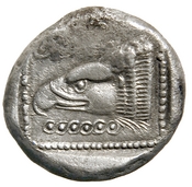 Reverse 'SilCoinCy A7680, acc.no.: 1977.158.591. Silver coin of king Pny (-) of Paphos 500 - 480 BC. Weight: 10.705g, Axis: 5h, Diameter: -. Obverse type: bull stg. l.. Obverse symbol: -. Obverse legend: - in -. Reverse type: eagle's hd. l. within incuse square. Reverse symbol: -. Reverse legend: - in -.
