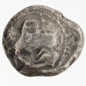 Obverse 'SilCoinCy A7004, acc.no.: 1992.53.4. Silver coin of king Uncertain king of Cyprus (archaic period) of Uncertain Cypriot mint ?  - . Weight: 10.71g, Axis: 12h, Diameter: 21mm. Obverse type: Ram walking l.. Obverse symbol: three signs in a script that seems NOT cyp. Syllab. 3 signs on REV. Obverse legend: - in -. Reverse type: Club & branch within incuse square. Reverse symbol: three signs in a script that seems NOT cyp. Syllab. 3 signs on REV :. Reverse legend: three signs in cypriot syllabic script (ka-pu-?) in -.